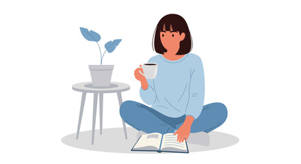 Fototapeta premium A woman sits cross-legged on the floor with a book and cup