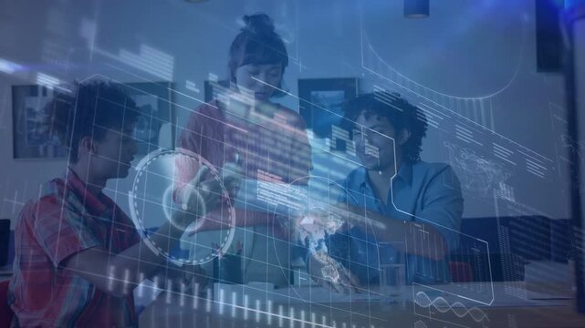 Tech team leaning at table as woman placing object, AR overlay showing charts, reviewing data
