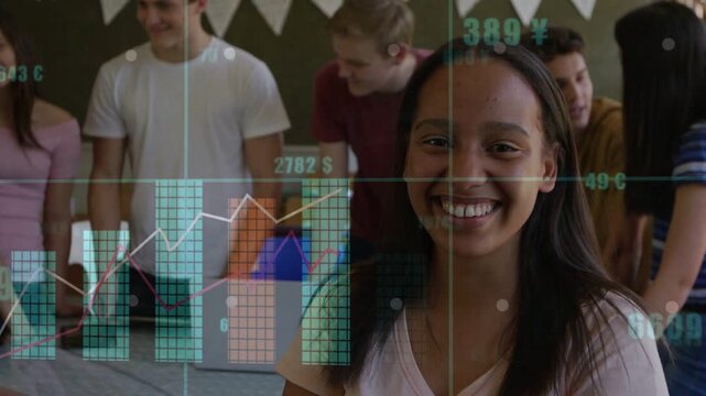 Teenage girl presenting in class while peers leaning toward laptop, sparking live graphs rising