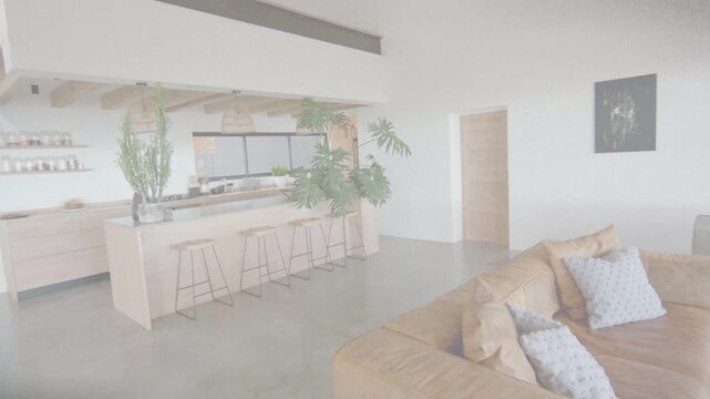 Open-plan living area being revealed by slow right camera pan, showing island and sofa for layout