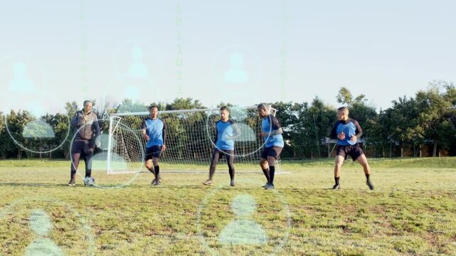 Coach gesturing by goal, signaling team jogging, forming wall and training jumps to block free kick