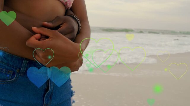 Man wrapping arms around woman waist hands clasping hearts drifting over couple affection marketing