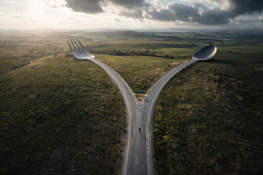 Fork in the road in the shape of a fork and spoon with a person.