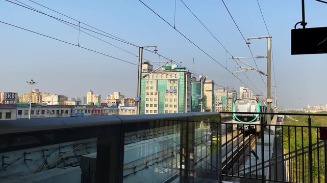 Noida Metro Train Arriving at Station Platform, Noida, Uttar Pradesh, India