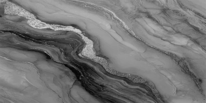 A stunning close-up of a marbled surface with fluid, swirling patterns in monochromatic tones, the image showcasing the natural beauty and intricate detail of the stone's texture.