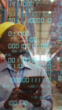 Vertical video: Warehouse tech tapping tablet, scanning racks and updating inventory via cyan HUD