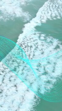 Vertical video: Swell starting surf moving, making foam while dotted mesh sliding to show flow
