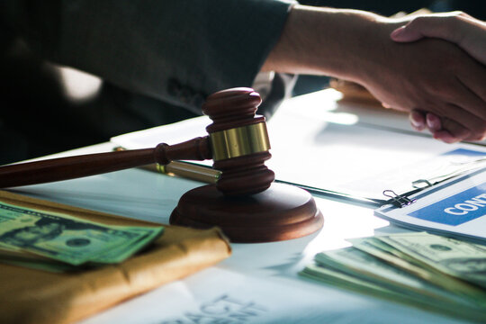 Consultation and conference of professional businesswoman and Male lawyers working and discussion having at law firm in office. Concepts of law, Judge gavel with scales of justice