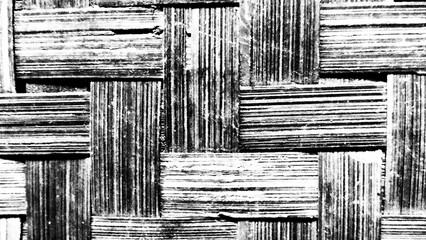 A weathered black and white textured wood wall showcases a rustic pattern of ancient timber planks from a vintage barn or building © WO