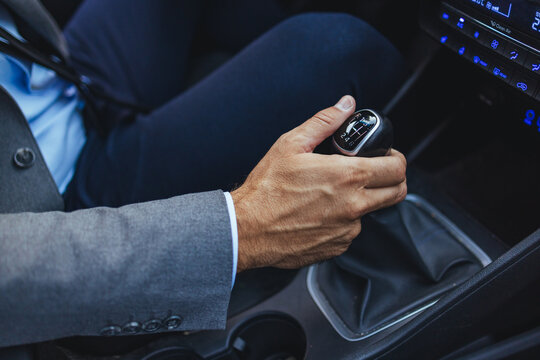 Businessman Driving Car With Manual Gear Shift Hand On Stick In Compact Interior