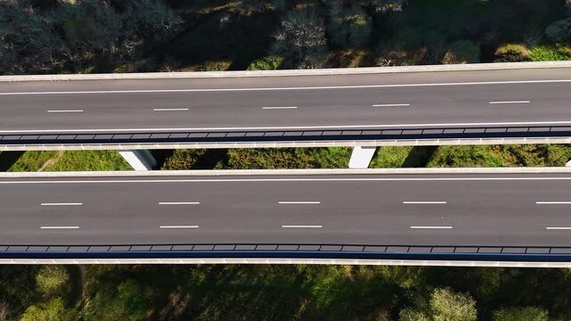 Aerial view of highway viaduct traffic driving