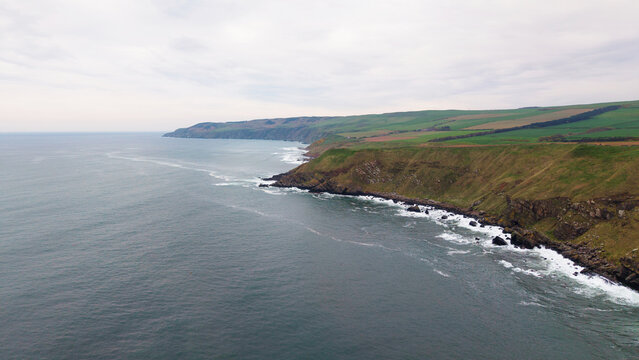 Panoramic view of the rugged coastline and ancient rock strata at Siccar Point in Berwickshire Scotland