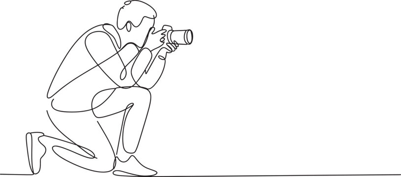 continuous line drawing of a male photographer with camera in crouching position.