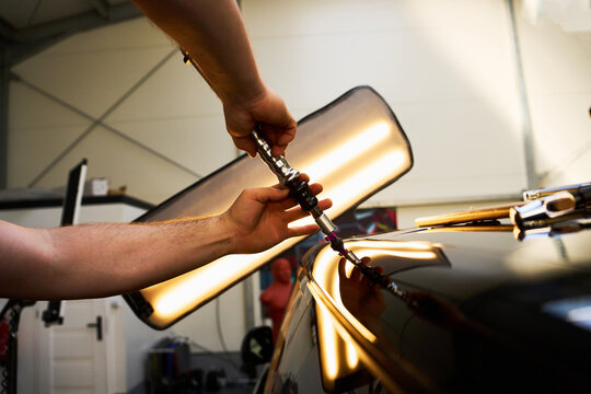 Cold glue pulling technique is used for paintless dent repair.