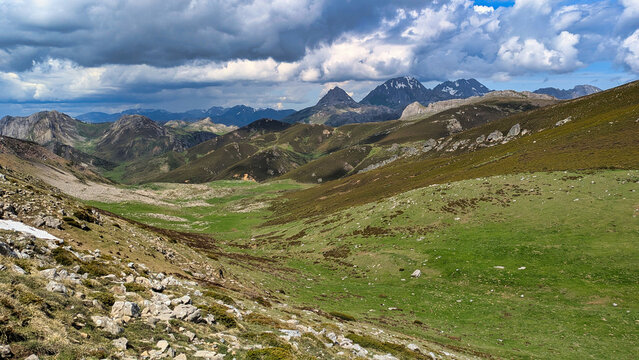 View of the Las Ubi&ntilde;as massif from Babia y Luna Natural Park, showcasing dramatic rocky peaks and rolling green highlands on the border between Asturias and Le&oacute;n in northern Spain