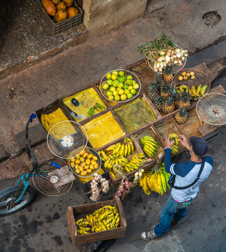 Cuba, Havana.  Overhead view of fruit and vegetable seller on the street in old Havana.