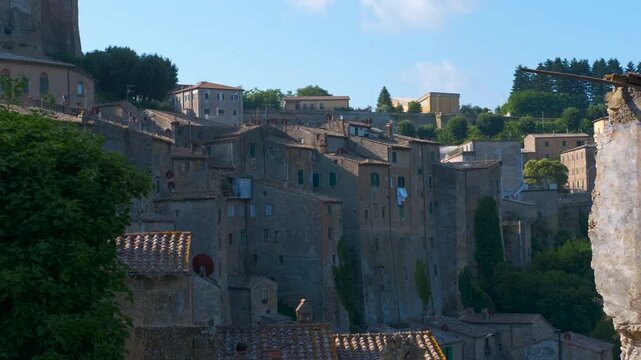 Scenic panorama of sorano in tuscany italy. Majestic panorama of sorano, an ancient medieval town built on a tuff cliff, revealing its characteristic historic houses clinging to the rock during