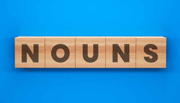 NOUNS Block: Wooden blocks spelling out NOUNS against a vibrant backdrop, perfect for educational content or concepts related to language and grammar.