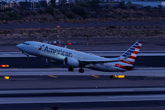 sky harbor airport 4-19-2026 Phoenix, AZ USAAmerican Airlines Boeing 737-Max8 N302UDJ sunset departure from Phoenix Sky Harbor Intl. Airport.