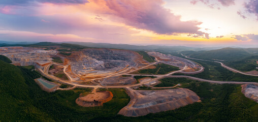 Stunning aerial view of expansive open pit mine in scenic industry panorama landscape at sunset © Parilov