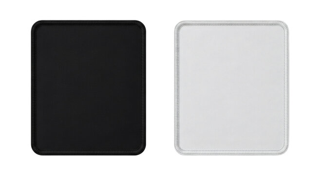 Pair of rectangular fabric mouse pads one solid black and one pure white showing stitched edges on transparent background
