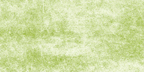 Fototapeta premium A green grass field background with an old grunge paper texture and an aged vintage border design