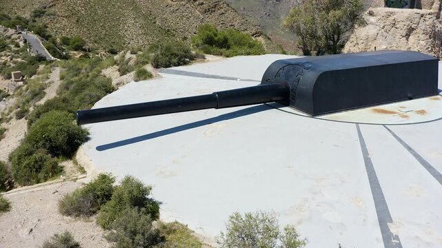 Drone view of the historic Bateria de Castillitos military coastal fortification, featuring the impressive Vickers 381mm naval guns overlooking the Mediterranean Sea in Cabo Ti&ntilde;oso, Spain. 