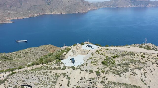Drone view of the historic Bateria de Castillitos military coastal fortification, featuring the impressive Vickers 381mm naval guns overlooking the Mediterranean Sea in Cabo Ti&ntilde;oso, Spain. 