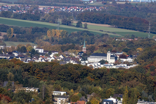 Iserlohn town located in a forested autumn landscape with residential and institutional buildings
