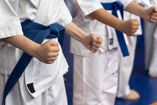 Close-up of young karate students in white gi