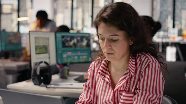 Woman staff working on laptop in smart office corporation at desk, providing business management for new strategy and project development. Worker ensuring productivity startup culture.