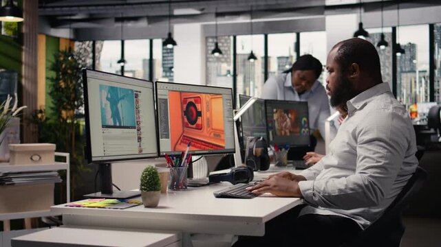 Black male game developer creating futuristic space video game, engineer uses programming tools and modeling software. Building a virtual world with spaceships and stations, automation.