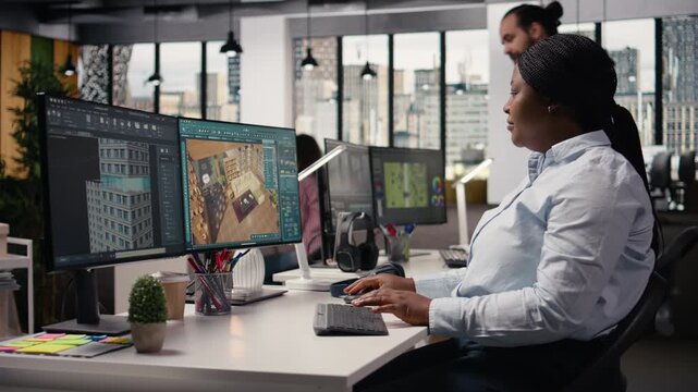 Architectural developer using CAD software to develop detailed floor plan layout in creative agency office. Engineer creates digital 3D modeling assets and prepares blueprints for construction.