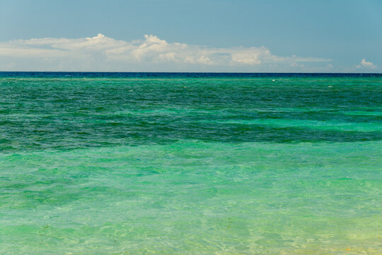Cuba, Cienfuegos, Rancho Luna beach.  Shadows and light play on the waters of the Caribbean Sea
