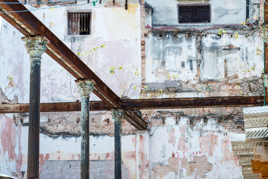 Cuba, Cienfuego.  The structural members are still in place of long collapsed residential building in old Havana