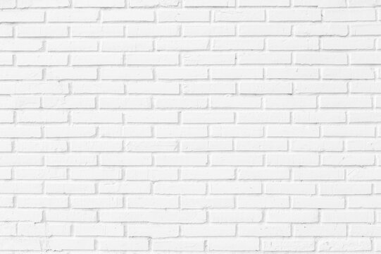 Modern white brick wall texture background for interior design and minimalist architectural backdrop with empty copy space
