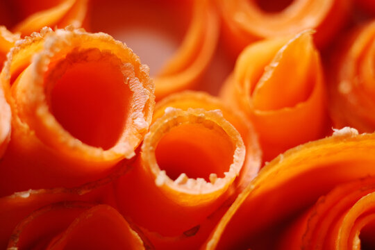 Macro texture of sliced carrot. Daucus Carota are a good source of several vitamins and minerals, especially biotin, potassium, and vitamins A from beta carotene, K1 phylloquinone and B6