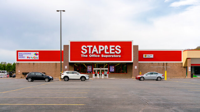 Camillus, NY - Apr 18, 2026: Ultra-wide view of Staples The Office Superstore, operates over 1000 U.S. location. The scene features the company&rsquo;s partnership with Party City and UPS shipping services