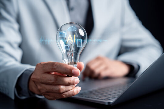 Person holding lightbulb with artificial intelligence digital icon. Cloud computing and smart technology innovation concept.