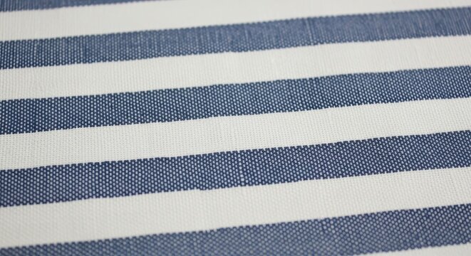 A close-up view of a blue and white striped fabric texture background blue and white stripes fabric 