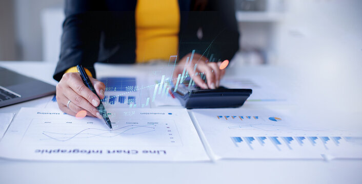 Business doing finances and calculating financial report with business graph growth chart, finance and investment Business Financing Accounting Banking Concept.