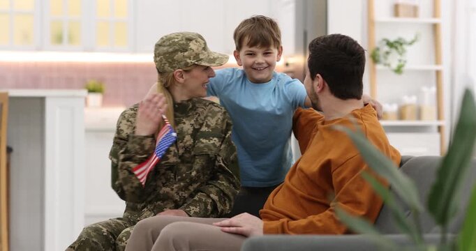 Woman in military uniform spending time with her family