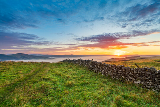 Beautiful sunrise scenery of Peak District with cloud inversion near Castleton. England
