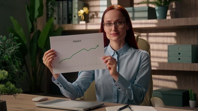 Successful Caucasian business woman holding paper growth chart finance documents indoor office businesswoman female girl showing economic data investor report sales income profit graph investment bank