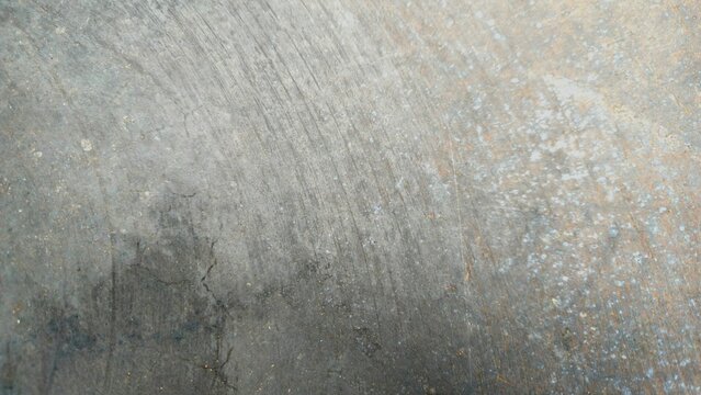 Scratched metal texture background with rust stains and industrial grunge surface. Grungy dark grey concrete texture background with weathered stains.