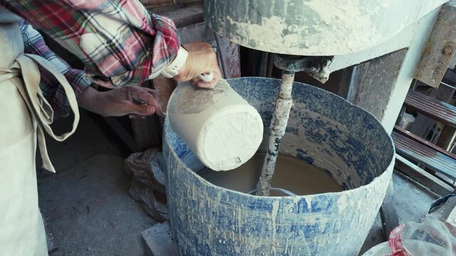 Clay Mud Swirling in an Industrial Ceramic Studio Mixer