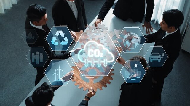 A diverse group of professionals engages in a collaborative meeting, focused on sustainability strategies using innovative technology and digital icons to visualize goals. Raster