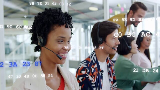 Female support agent answering incoming call using headset while hex codes overlaying screens