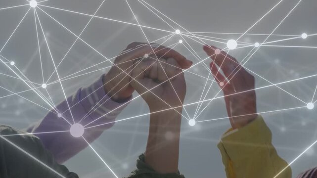 Small peer group initiating fingertip touch skyward, stacking hands for unity, tech nodes glowing