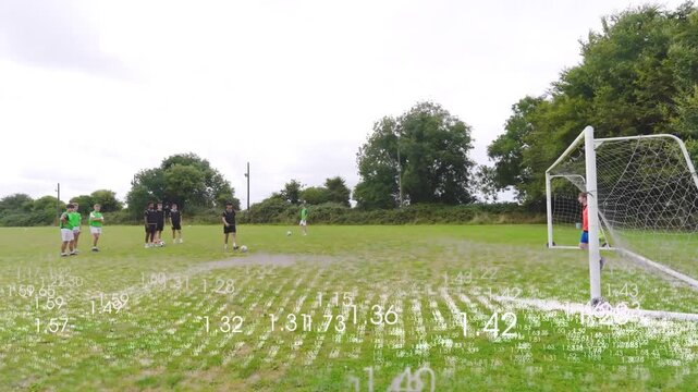 Kicker planting ball running, striking for soccer while white overlay tracking shot, keeper diving